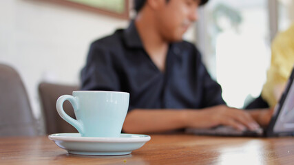 Coffee cups placed on wooden tables