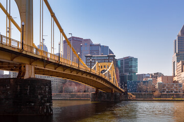 The Roberto Clemente Bridge that connects downtown Pittsburgh and the North Shore. This is in Pennsylvania USA and the bridge sits atop the Allegheny River. - obrazy, fototapety, plakaty