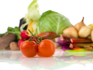 vegetarian ingredients with tomatoes in foreground