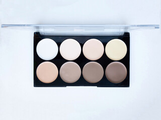 Close-up of contouring for makeup, a set of concealers in various colors. Beauty concept.