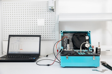 Working equipment of the specialist of the laboratory of metrology and standardization. Measuring instruments and vibration stands for testing equipment resistance to vibration.