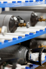 Storage of metal gray cylinders with compressed gas nitrogen and carbon dioxide. Testing in a metrological laboratory and analyzing gas composition.