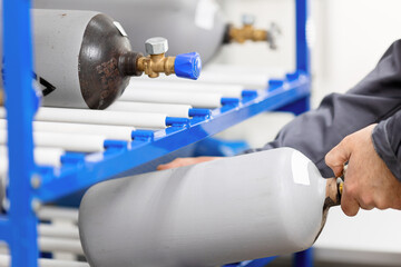 Storage of metal gray cylinders with compressed gas nitrogen and carbon dioxide. Testing in a...
