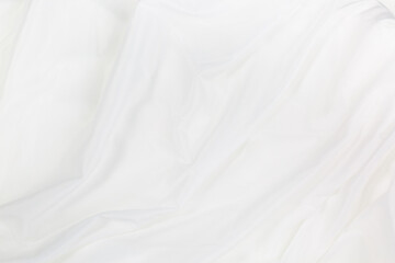 Obraz premium White cloth background abstract with soft waves,Closeup elegant crumpled of white silk fabric cloth background and texture. Luxury background design.