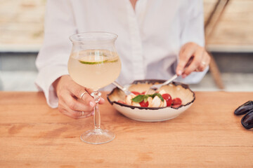 Close up shot of woman eating salad in restaurant