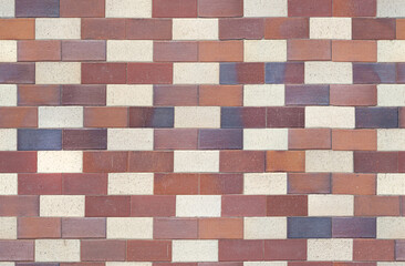 Seamless texture of street tiles. Geometric pattern of pavement from yellow, brown, purple tiles of various shades.