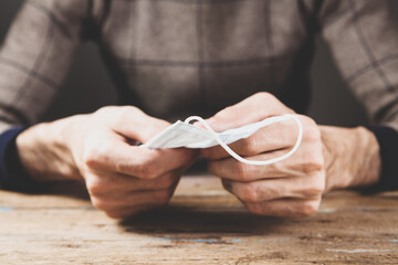 a man holding a medical mask
