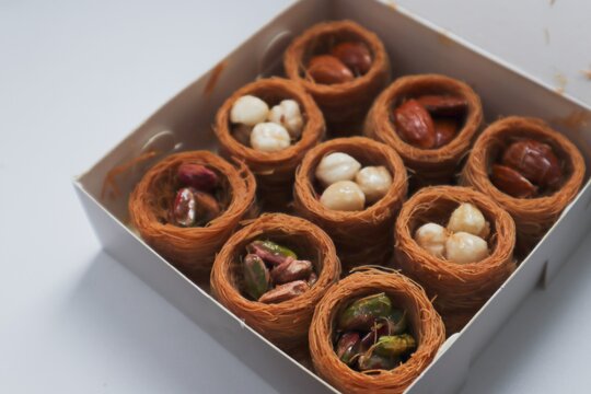 Oriental sweets kunafa with nuts in a white box