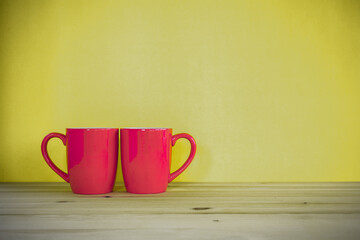 Red coffee cups on table 