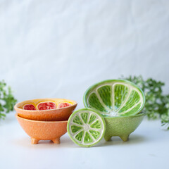 Ceramic cup in the form of half a lime.