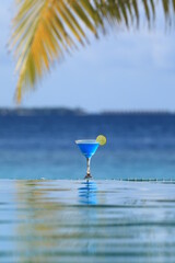 blue alcoholic cocktail on tropical island in Indian Ocean, Maldives