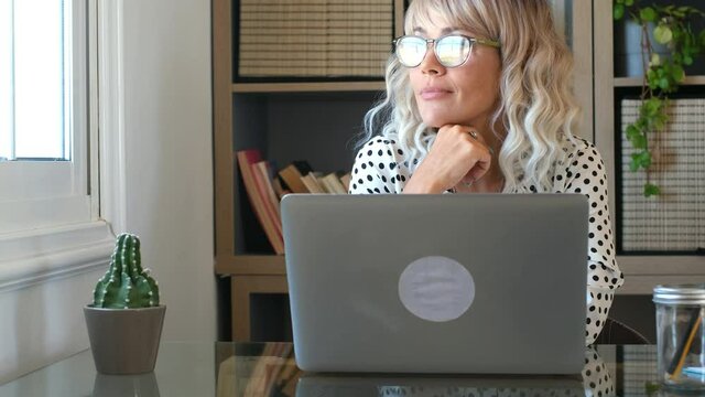 Home work people female freelance lifestyle concept - portrait of adult woman with online job and computer internet connection - modern employee businesswoman with eyewear