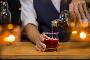 Bartender Serve Whiskey, on wood bar, 