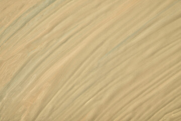 Abstract fluid art background light brown colors. Liquid marble. Acrylic painting on canvas with beige gradient.