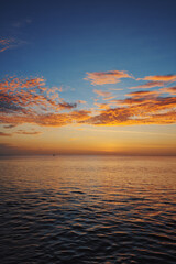 Beautiful seascape with sunset cloudy sky.