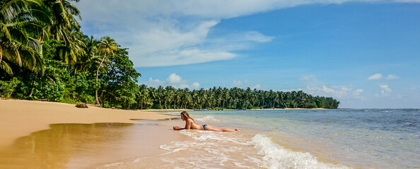 girl laying on the beach  © Kamila
