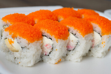 Rolls with Salmon and caviar served on a plate