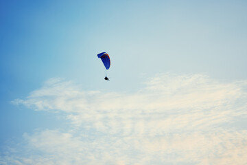 Paraplane on the blue sky background, leisure activity.