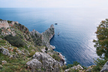 Fototapeta na wymiar Beautiful landscape with rock cape and ship sailing sea. Alanya, Turkey.