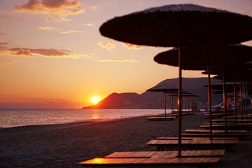 Beautiful landscape. Traveling by Turkey. Sea Beach with sunloungers and umbrellas.