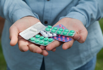 Man holding pills. Concept of medicine.