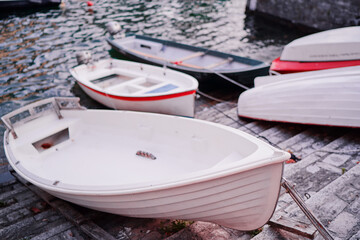 Fototapeta na wymiar Wooden boats moored in the harbor marina.