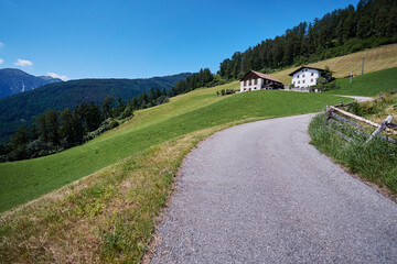 Asphalt road in Alps mountains. Trip concept.