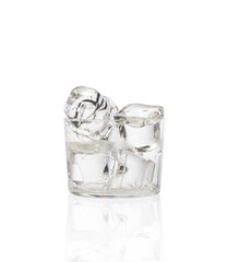 Glass with ice on a white background 