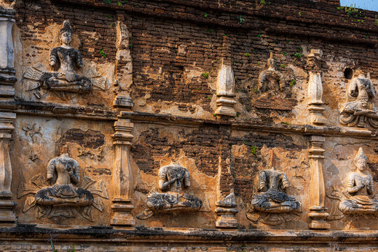 Old Ancient stucco patterns stucco Buddha and angel figures on the outside of the Maha Chedi Wat Chet Yot, seven pagoda temple It is a major tourist attraction in Chiang Mai, Thailand.