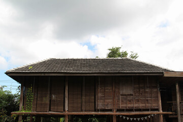 Fototapeta na wymiar The old wooden Northern Thai country style hut.