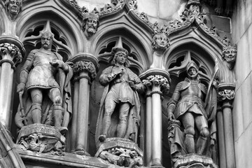 Sandstone figures at the entrance to St. Giles Cathedral, also known as the High Kirk of Edinburgh, Scotland