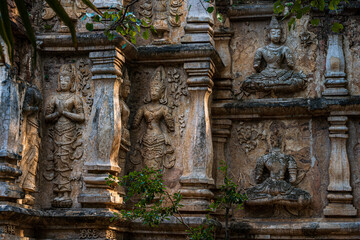 Old Ancient stucco patterns stucco Buddha and angel figures on the outside of the Maha Chedi Wat Chet Yot, seven pagoda temple It is a major tourist attraction in Chiang Mai, Thailand.