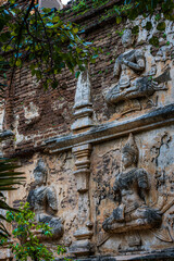 Old Ancient stucco patterns stucco Buddha and angel figures on the outside of the Maha Chedi Wat Chet Yot, seven pagoda temple It is a major tourist attraction in Chiang Mai, Thailand.