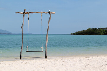 The wooden swing on the beach.