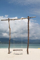 The wooden swing on the beach.