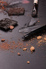 Colorful photo with various cosmetic products on a dark background