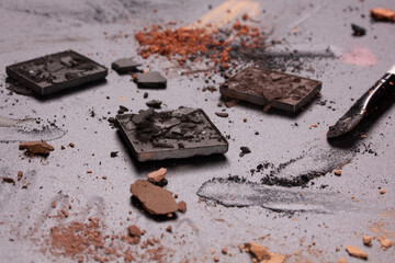 Colorful photo with various cosmetic products on a dark background