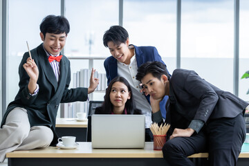 Successful Joke happy workers Group of asian business people with diverse genders (LGBT) workers with in company support in the meeting room at office