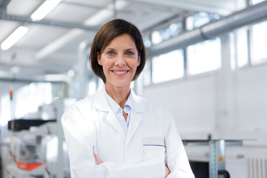 Smiling Female Scientist At Laboratory