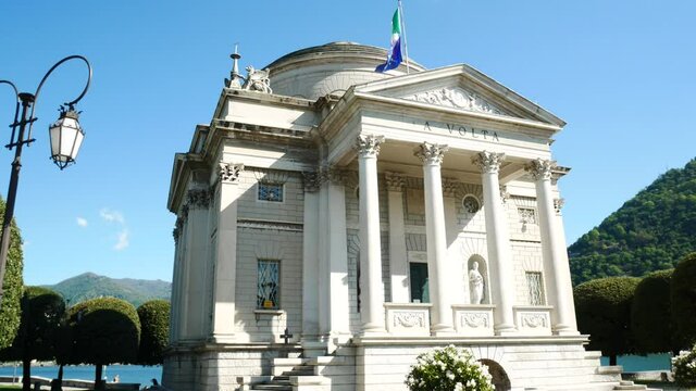 The facade of the famous "Tempio Voltiano" (meaning: Alessandro Volta's temple), Como, Italy, with a street lamp. Alessandro Volta was an italian scientist.
