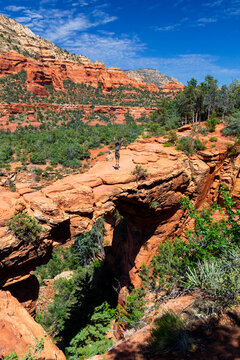 Mature male hiker on Devil's Bridge Trailhead during sunny day, Sedona, Arizona, USA