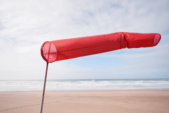Windsock or windbag, wind direction indicator on the beach.