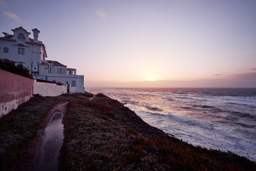 Fototapeta na wymiar Beautiful sunset in portuguese village on the ocean shore.