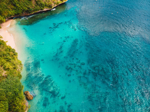 Aerial view of tropical beach with crystal turquoise ocean