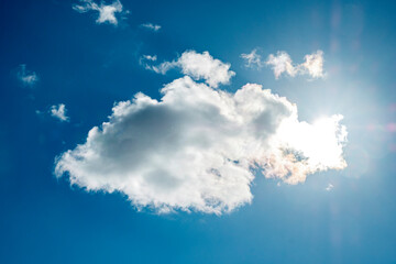 Blue sky background with a tiny clouds