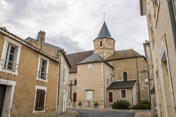 Obraz premium traditional street in France with a church in the background