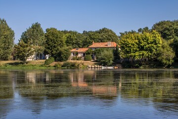 reflections in a river in rural France