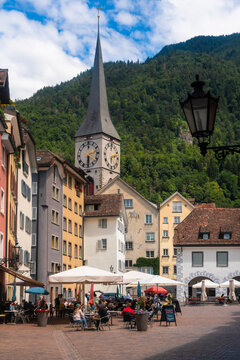 Arcas Square with the spire of St martin church in the background against mountain at Chur, Switzerland
