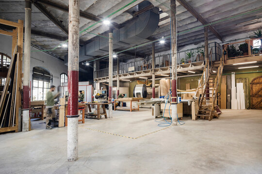 Male carpenters working in carpentry workshop