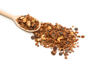 Chocolate granola cereal with nuts in a wooden spoon.